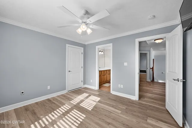 a view of a room with wooden floor
