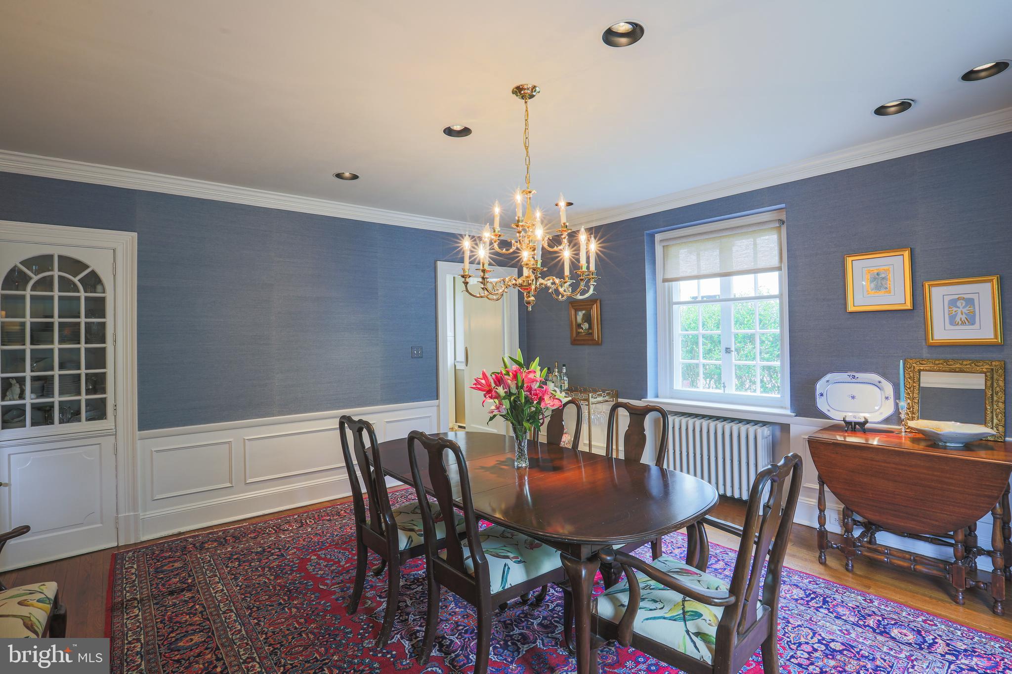 5502 Roland Avenue Baltimore, MD 21210 - Photo 12 of 47 High-end wall sconces, built-in china cabinet