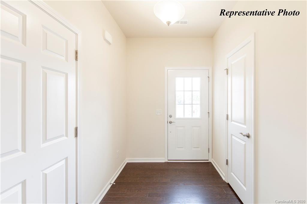 826 Canoe Song Road, Unit 359 Fort Mill, SC 29708 - Photo 3 of 18 a view of a hallway with wooden floor
