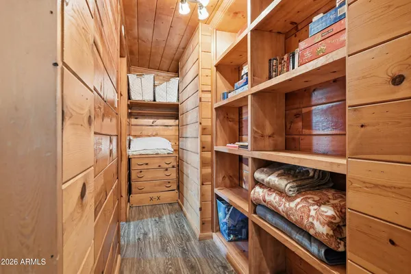a view of walk in closet with empty racks