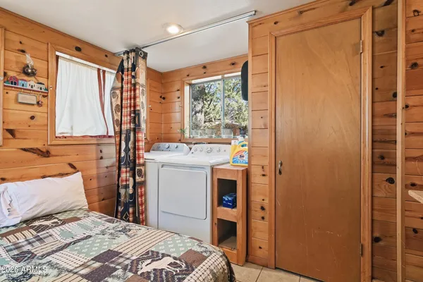 a bedroom with a bed and a dresser