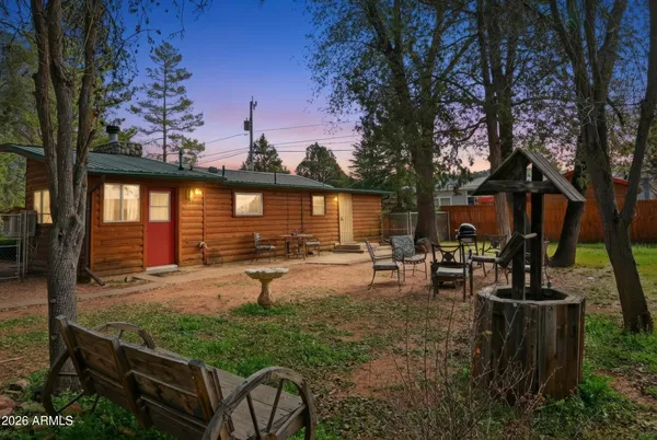 a view of a backyard with sitting area