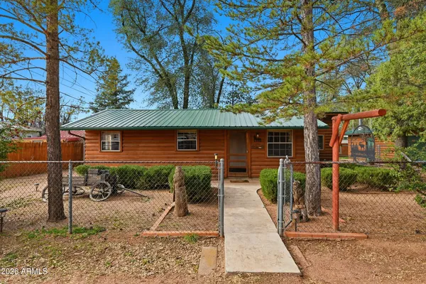 a backyard of a house with yard barbeque oven and outdoor seating