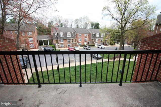 a bathroom with a granite countertop toilet and a sink