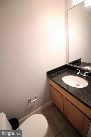 a view of an empty room with closet area