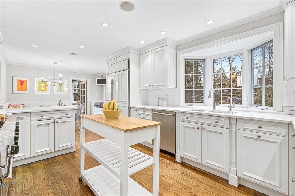 14 Rockridge Road Wellesley, MA 02481 - Photo 13 of 42 a kitchen with granite countertop white cabinets and white appliances