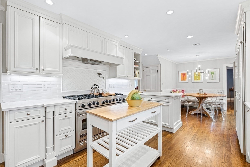 14 Rockridge Road Wellesley, MA 02481 - Photo 14 of 42 a kitchen with white cabinets stove and kitchen island