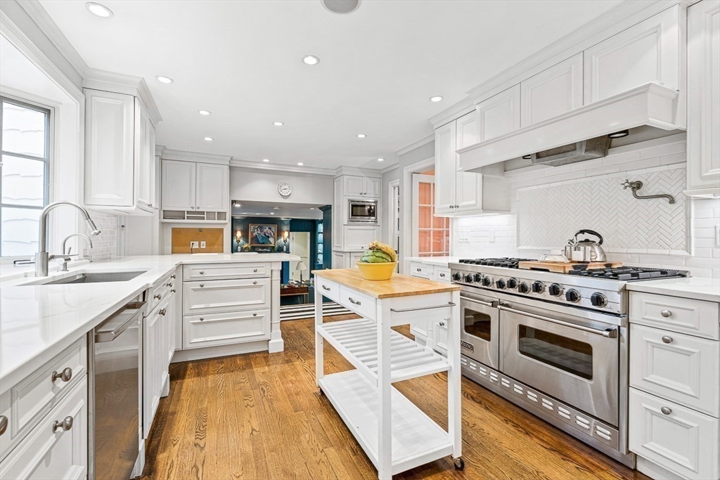 14 Rockridge Road Wellesley, MA 02481 - Photo 15 of 42 a kitchen with stainless steel appliances granite countertop a stove a sink and a refrigerator