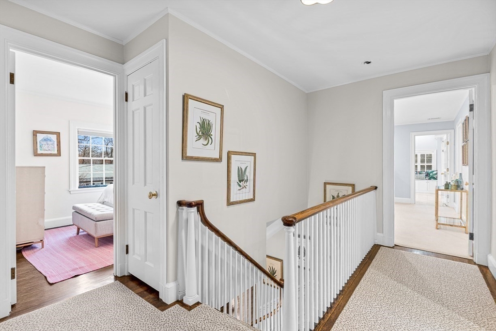 14 Rockridge Road Wellesley, MA 02481 - Photo 26 of 42 a view of a hallway with a livingroom with furniture and stairs