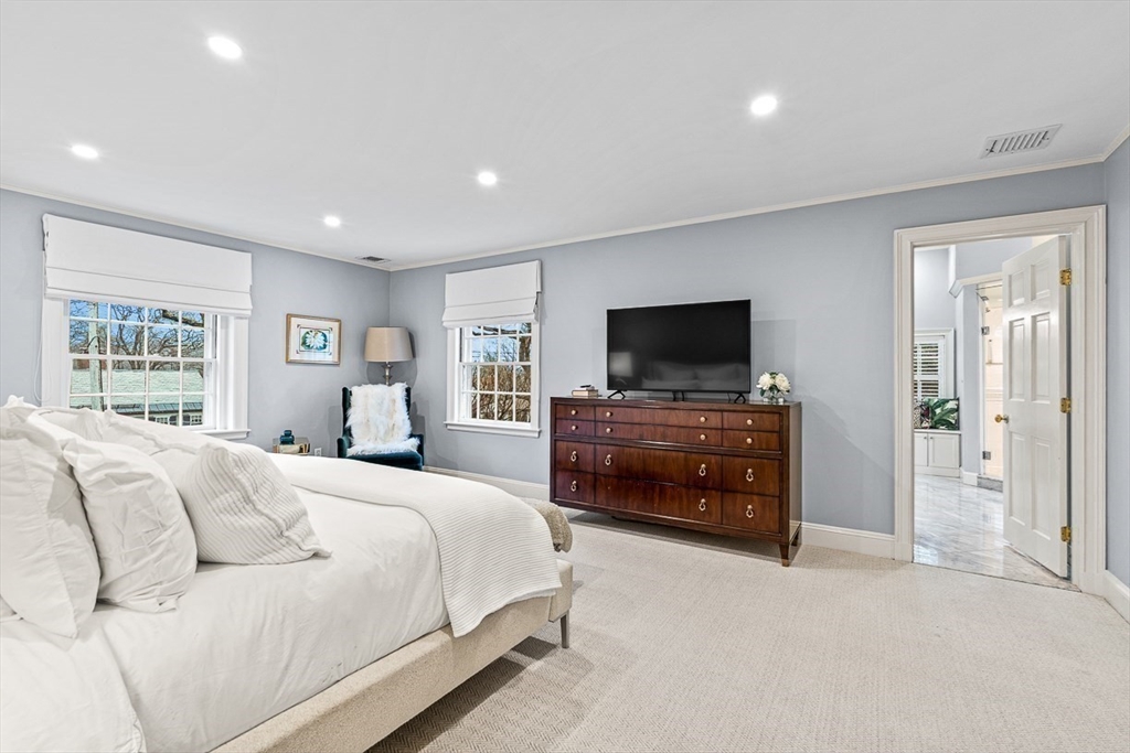 14 Rockridge Road Wellesley, MA 02481 - Photo 28 of 42 a bedroom with a bed and a flat screen tv