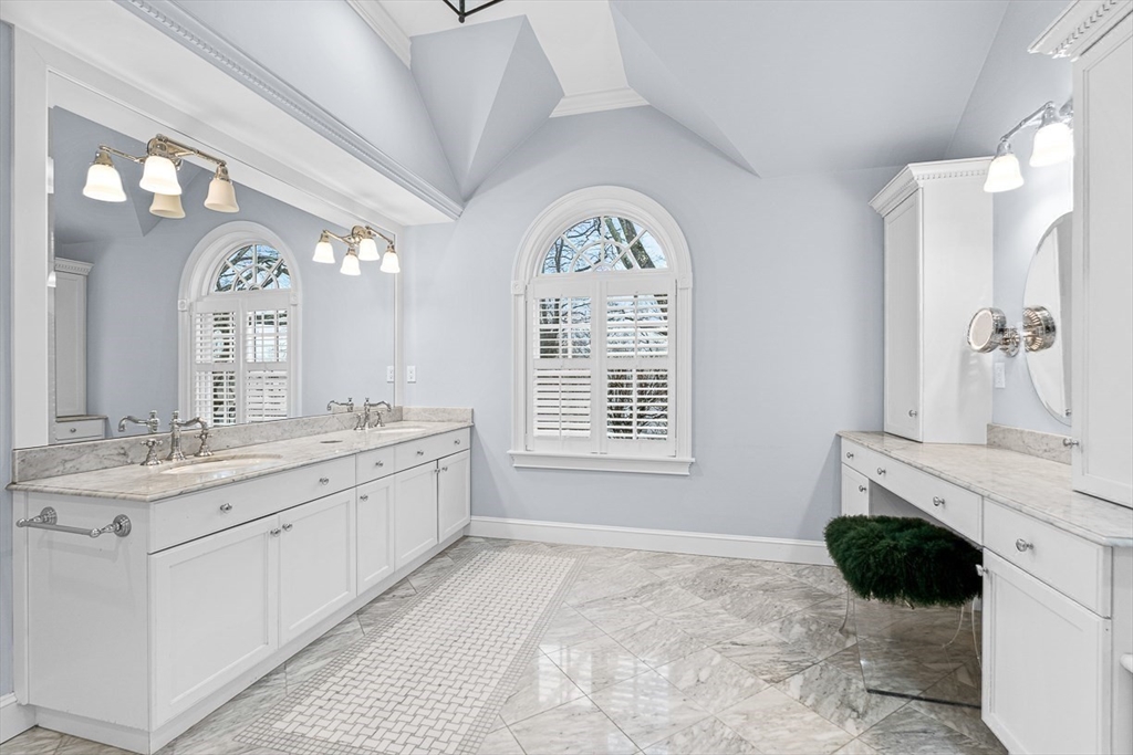 14 Rockridge Road Wellesley, MA 02481 - Photo 32 of 42 a spacious bathroom with a granite countertop sink a mirror and a bathtub next to a window