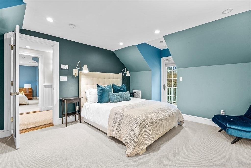 14 Rockridge Road Wellesley, MA 02481 - Photo 36 of 42 a bedroom with a bed and a couch
