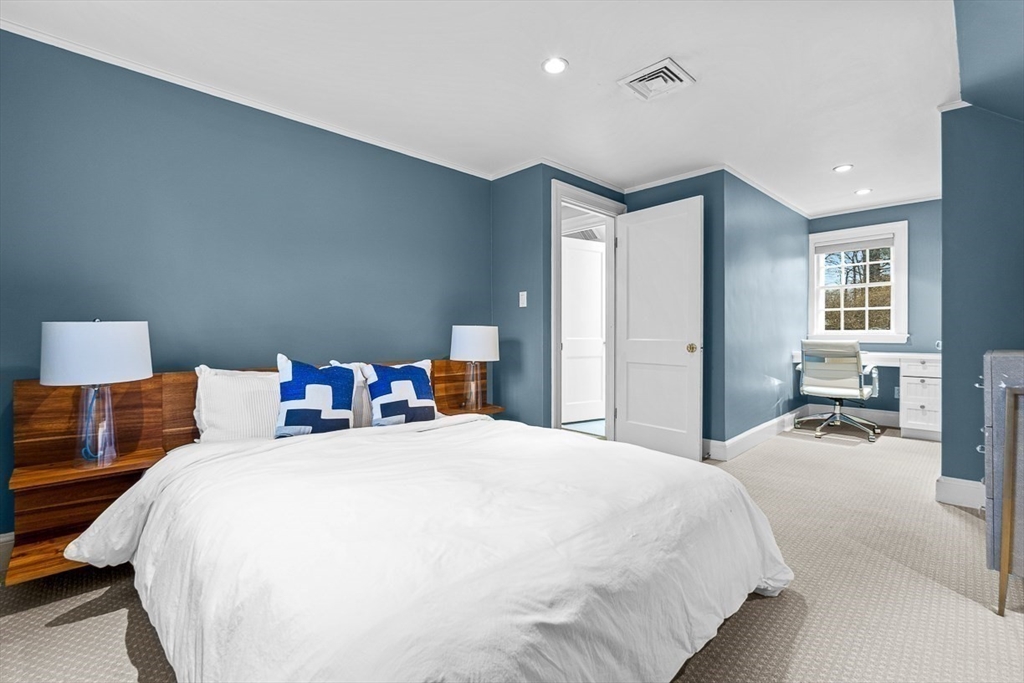14 Rockridge Road Wellesley, MA 02481 - Photo 38 of 42 a bed room with a bed and a lamp
