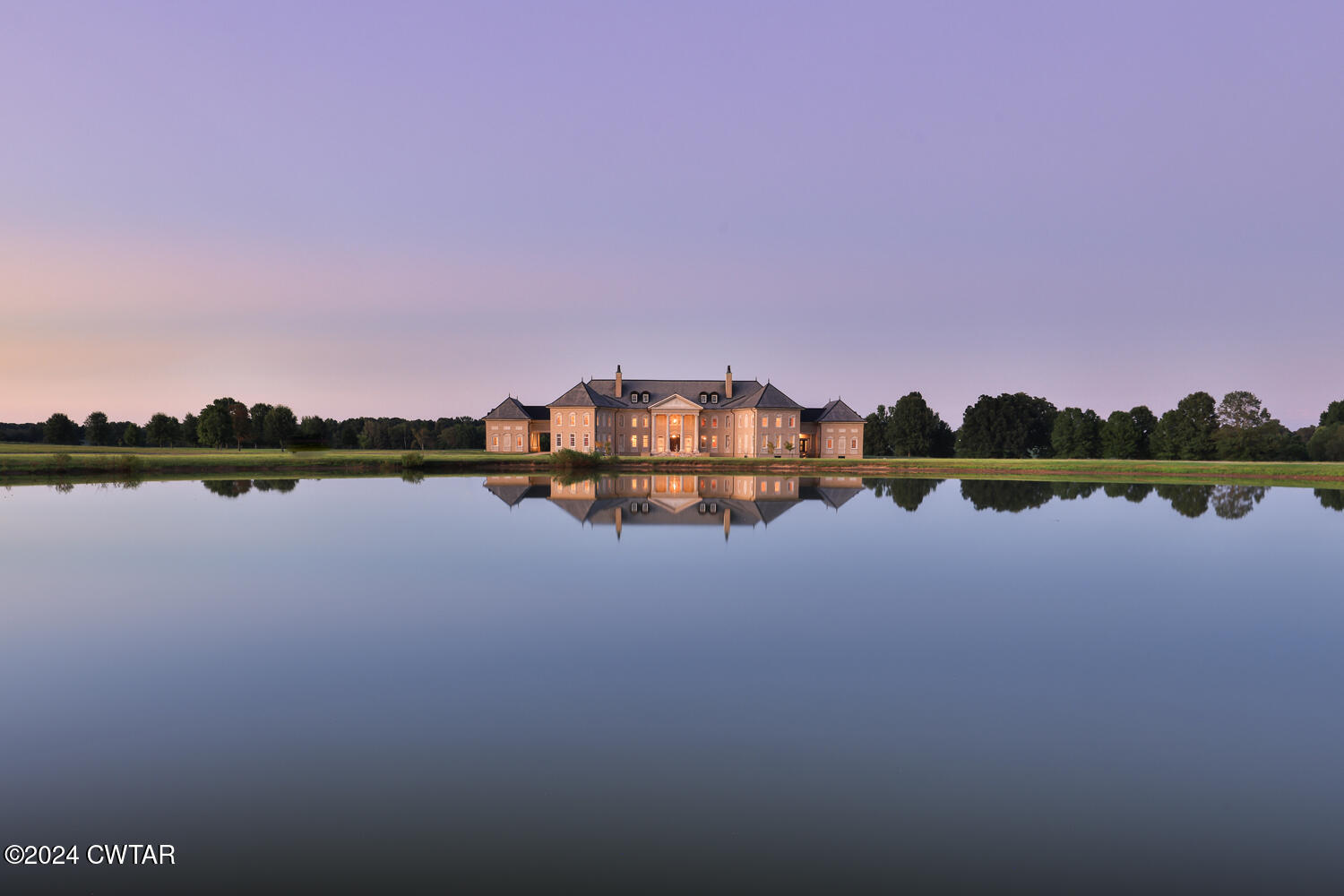 a view of a lake with houses in the background