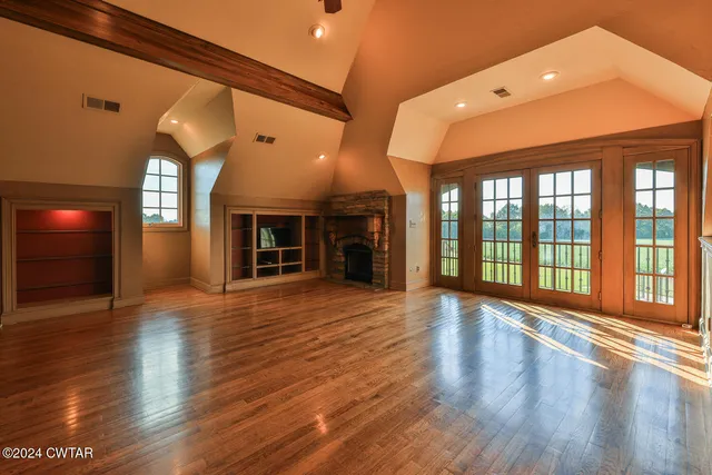 a front view of a house with a fountain