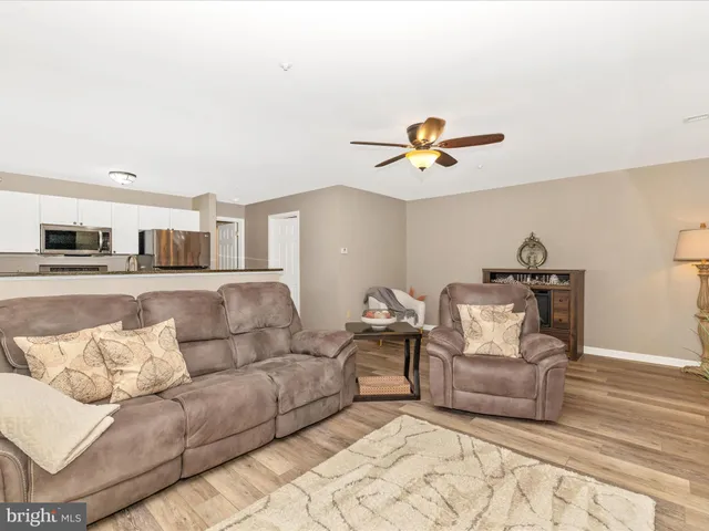 a kitchen with granite countertop a sink and a stove