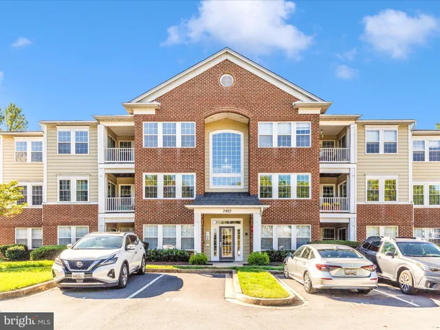 a front view of a residential apartment building with swimming pool