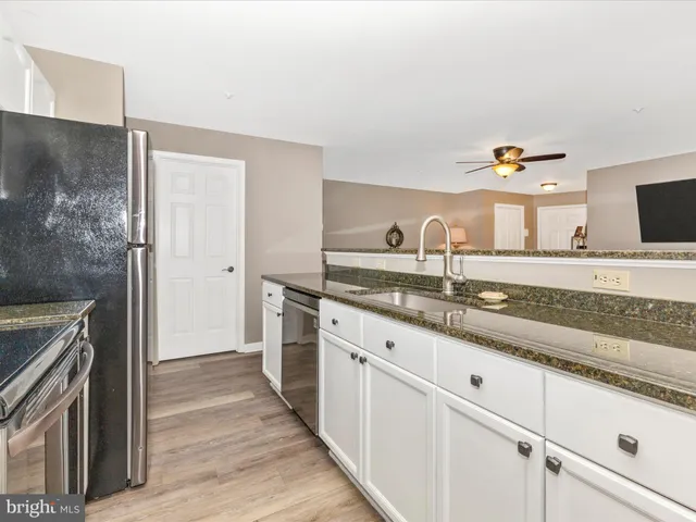 a kitchen with a stove microwave and refrigerator