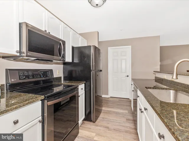 a dining room with furniture window and outside view