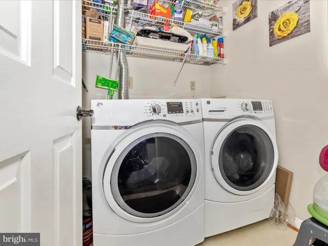 a bedroom with a large bed and a large window