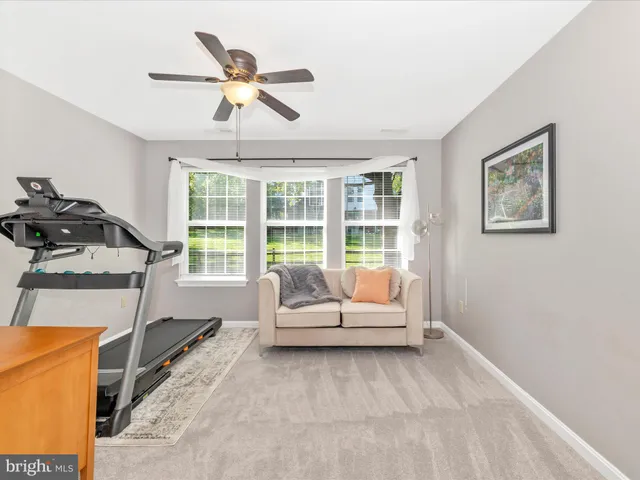 a bathroom with a sink mirror vanity and toilet