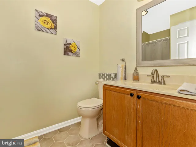 a view of a patio with table and chairs and potted plants