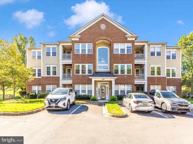 a view of a swimming pool with an outdoor space and seating area