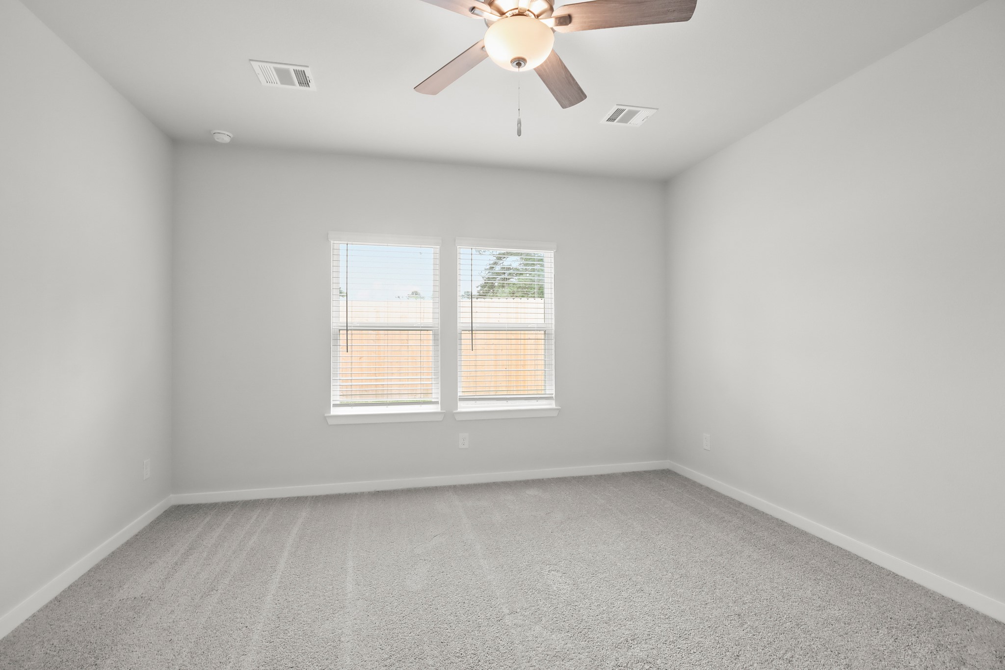 225 Spring Drive Hockley, TX 77447 - Photo 10 of 24 an empty room with a window