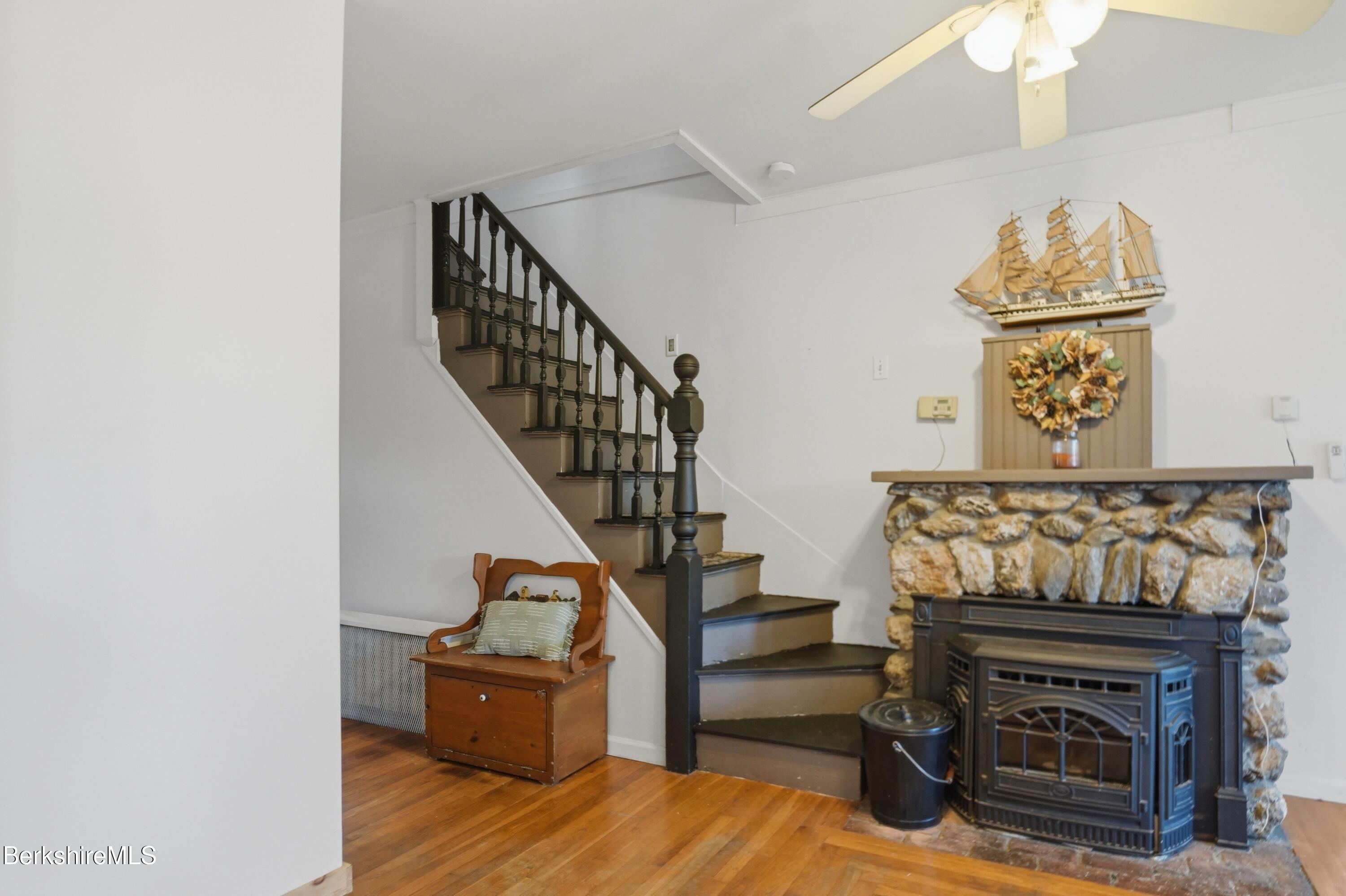 22 Broadway Street Pittsfield, MA 01201 - Photo 42 of 84 a living room with furniture and a fireplace