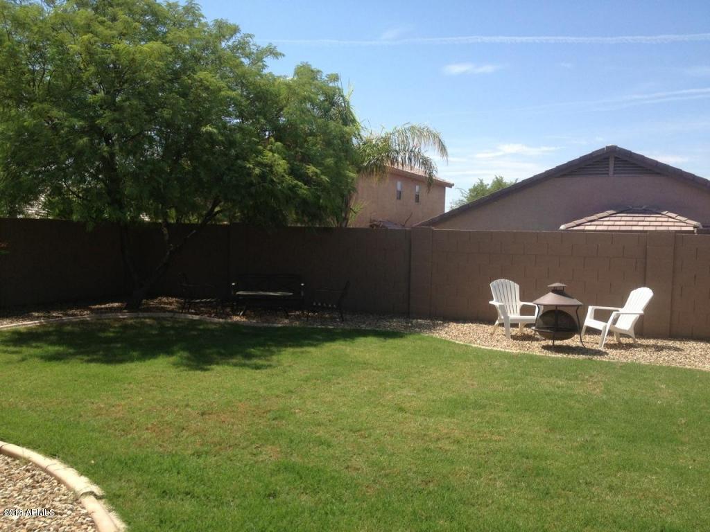 17259 West Apache Street Goodyear, AZ 85338 - Photo 3 of 6 apache grassy back yard 2
