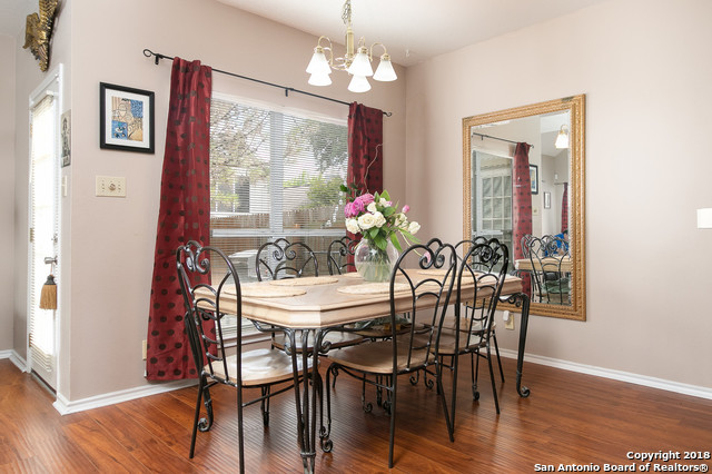 5858 Spring Square San Antonio, TX 78247 - Photo 11 of 21 a view of a dining room with furniture window and wooden floor