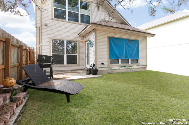 5858 Spring Square San Antonio, TX 78247 - Photo 19 of 21 a view of a house with backyard sitting area and garden
