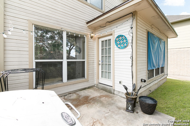 5858 Spring Square San Antonio, TX 78247 - Photo 20 of 21 a backyard of a house with table and chairs