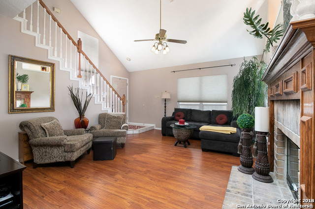 5858 Spring Square San Antonio, TX 78247 - Photo 5 of 21 a living room with fireplace furniture and a wooden floor