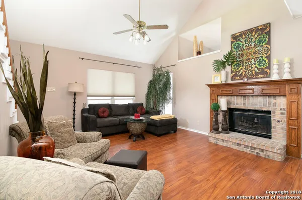 a living room with furniture fireplace and a flat screen tv
