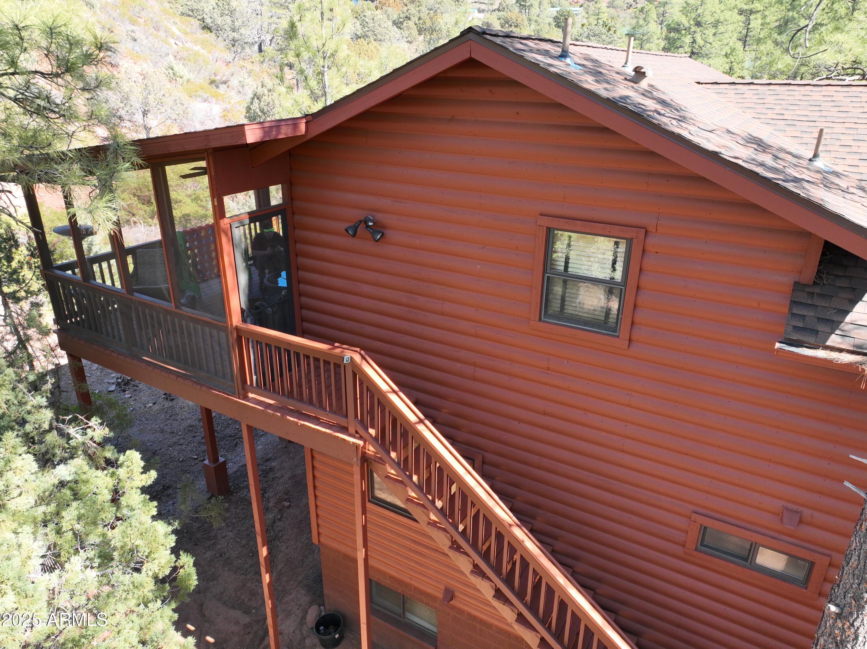 5579 Solitude Trail Loop Pine, AZ 85544 - Photo 12 of 50 a front view of a house with balcony
