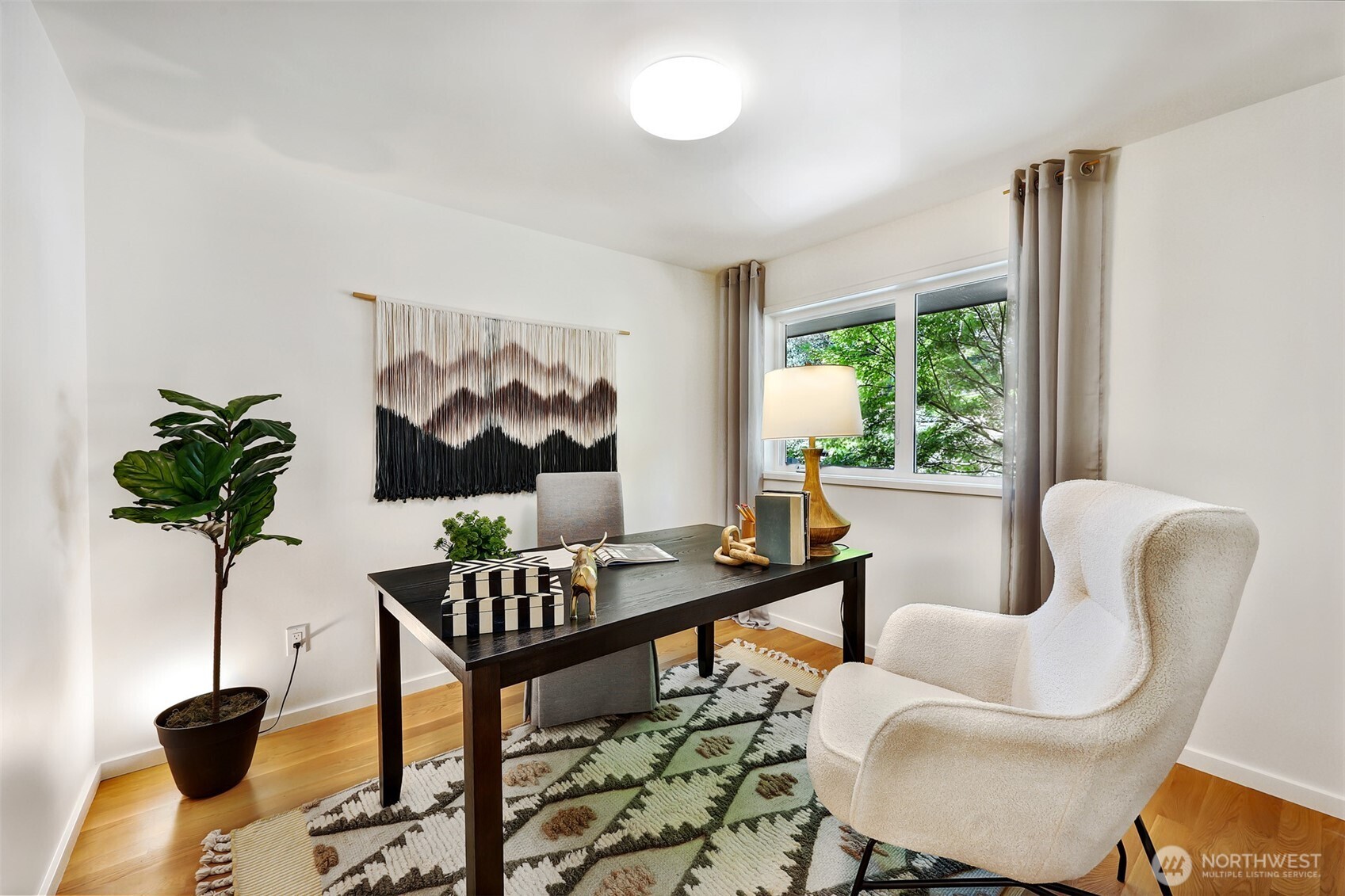 2547 Northeast 83rd Street Seattle, WA 98115 - Photo 24 of 38 a work room with furniture and a potted plant