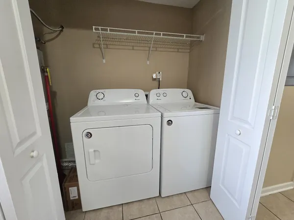 a utility room with dryer and washer