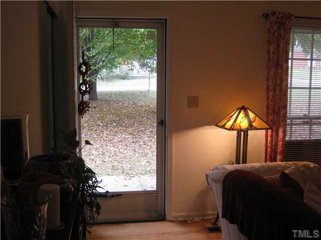3806 Wester Road Raleigh, NC 27604 - Photo 7 of 12 Entry to this Traditional Brick/Vinyl Ranch looking out front door to a fall view of front lawn!