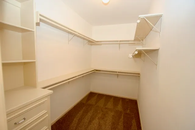 a view of an empty walk in closet