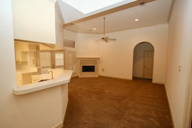 a view of a kitchen with a sink and a dishwasher