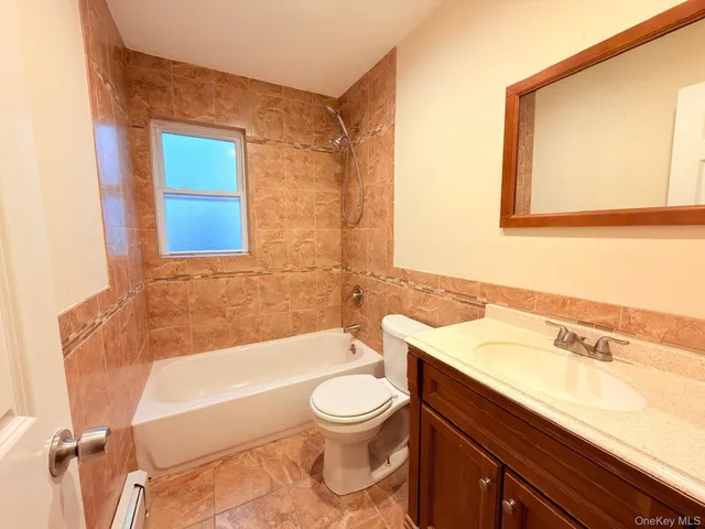 a bathroom with a sink a toilet and a bathtub