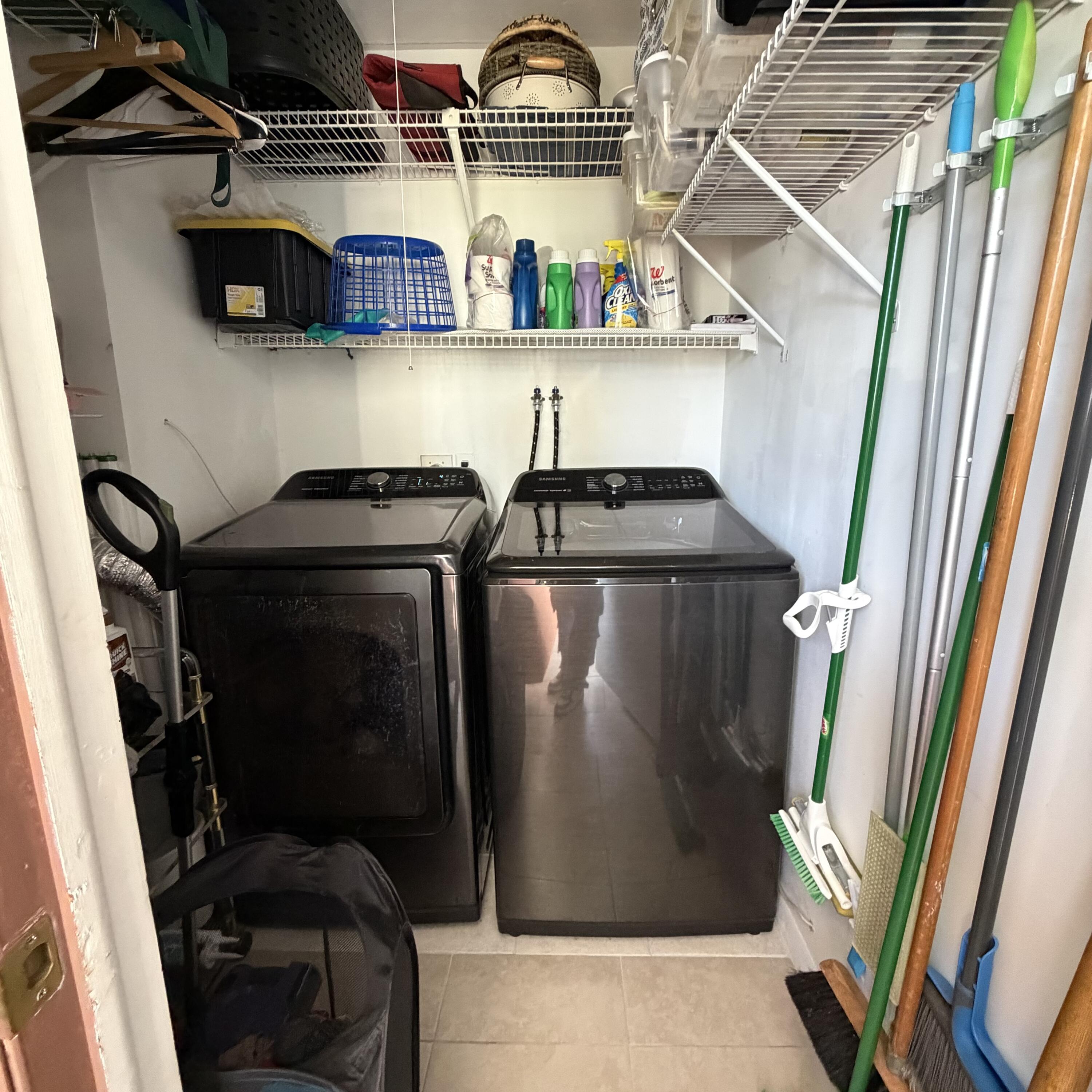 728 Normandy Lane, Unit P Delray Beach, FL 33484 - Photo 12 of 12 a view of walk in closet with clothes and shoes