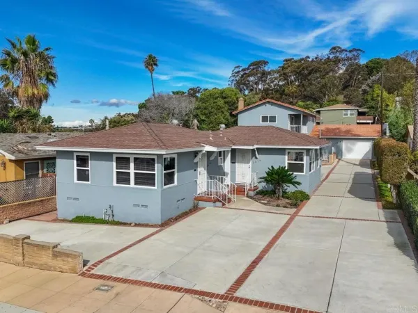 front view of a house with a yard