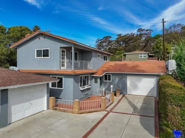 a front view of a house with a garage