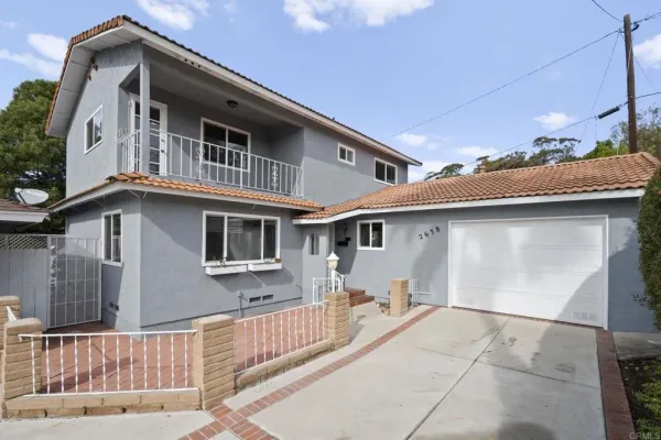 a front view of a house with a garage