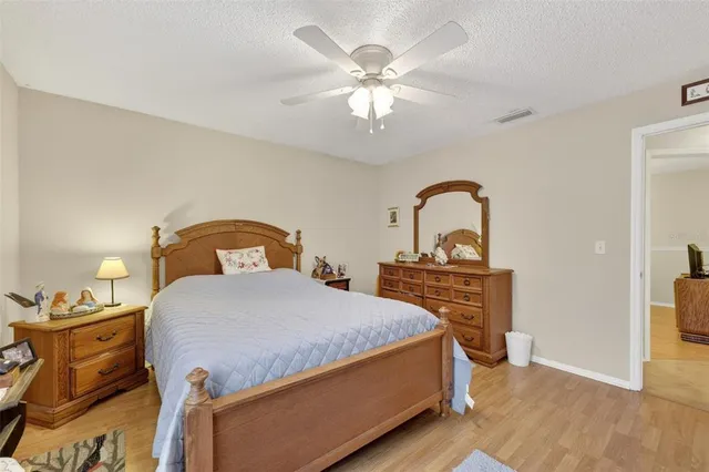 a bedroom with a bed and dresser