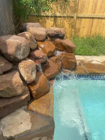 a view of a backyard of the house