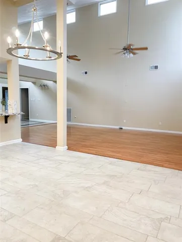 a view of a livingroom with a kitchen counter tops and a fireplace