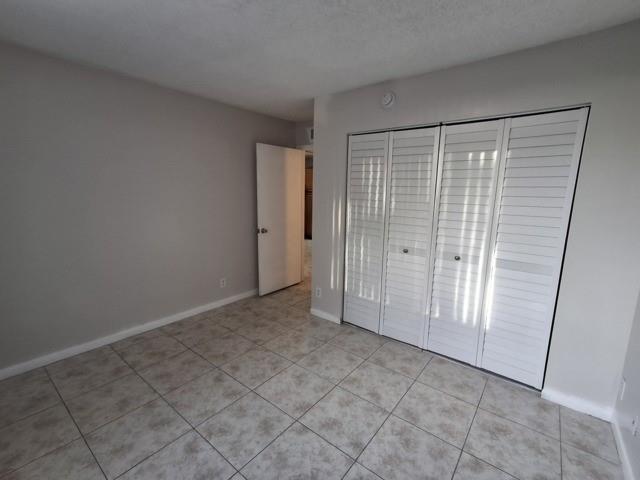 741 Lyons Road, Unit 17106 Coconut Creek, FL 33063 - Photo 12 of 28 a view of an empty room